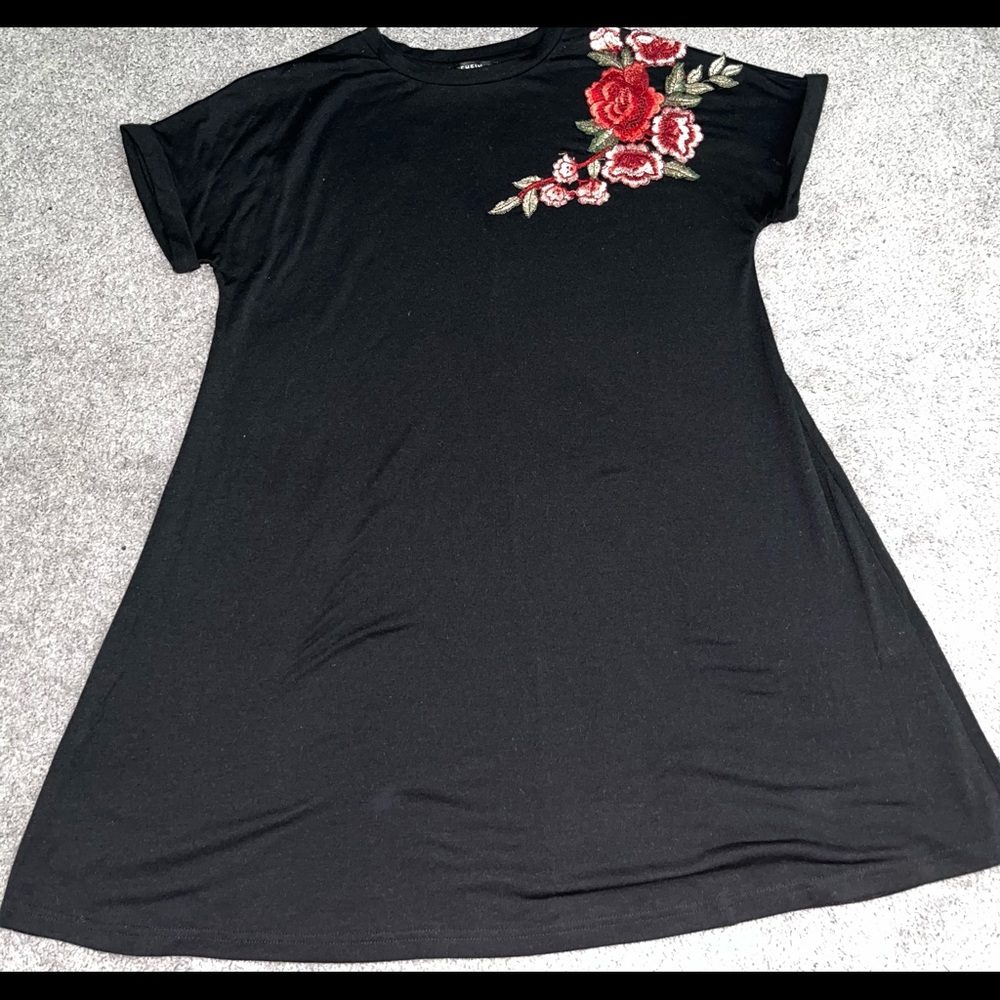 This dress has been worn , Color : Black, was red flowers  on the right side